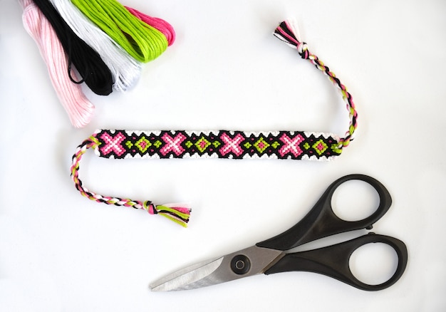 Woven DIY friendship bracelet with abstract pattern