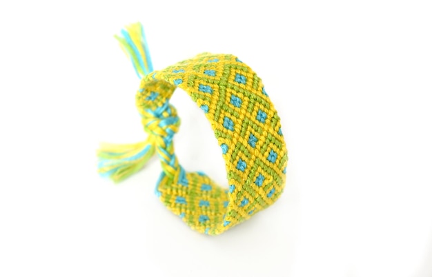 Woven DIY friendship bracelets handmade of embroidery bright thread with knots on white