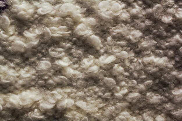 Woven grey wool fabric texture hand knit textile canvas background patchwork carpet backdrop
