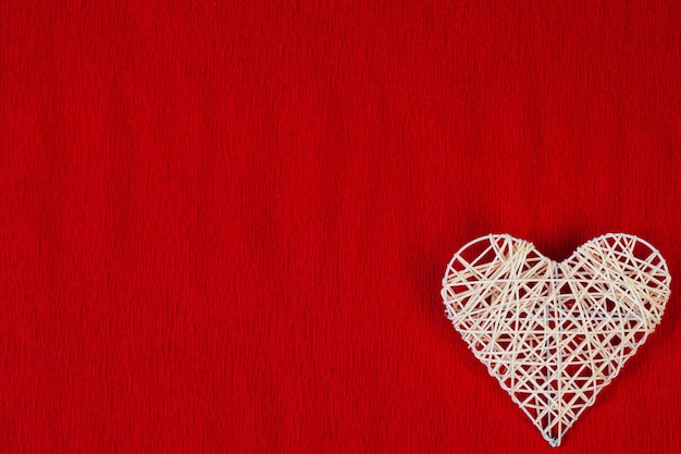 Woven heart on a red corrugated paper