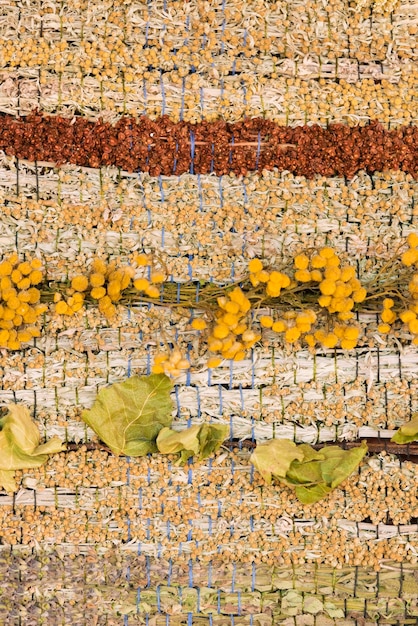 Woven panels of dried herbs close up background