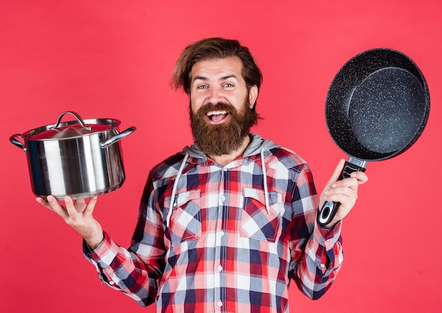 Wow Cooking healthy food Professional chef man cook in checkered shirt bearded husband Restaurant Enameled cast iron cooking vessels Nonstick pan coated polytetrafluoroethylene teflon