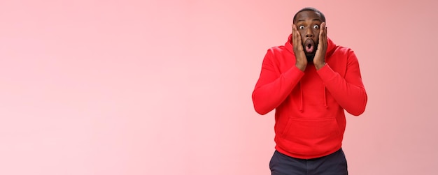 Wow incredible portrait impressed surprised africanamerican bearded guy in red hoodie folding lips b