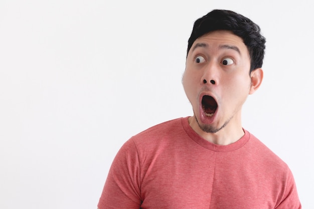 Premium Photo | Wow and shocked face of funny man isolated on white wall