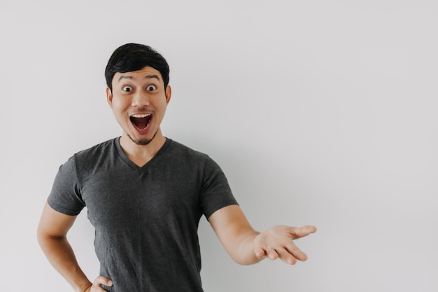 Wow surprise shock face man in black tshirt isolated on white background