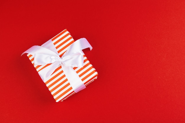 Wrapped gift box on a red background