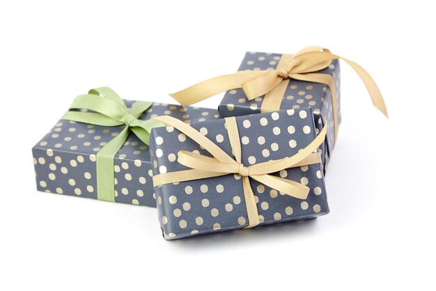 Wrapped gift boxes isolated on white Three green gift boxes Christmas or birthday gift boxes for present