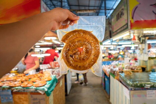 Wrapped packaging of Sai Aua Northern Thailand Spicy Sausage a famous Traditional Local saurage cooked with curry and herb at shop and ready for sales