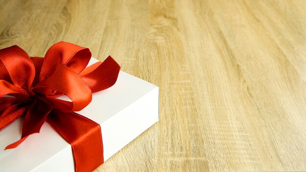 Wrapped present box on wooden board