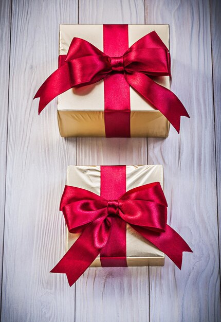 Wrapped present boxes on wooden board holidays concept