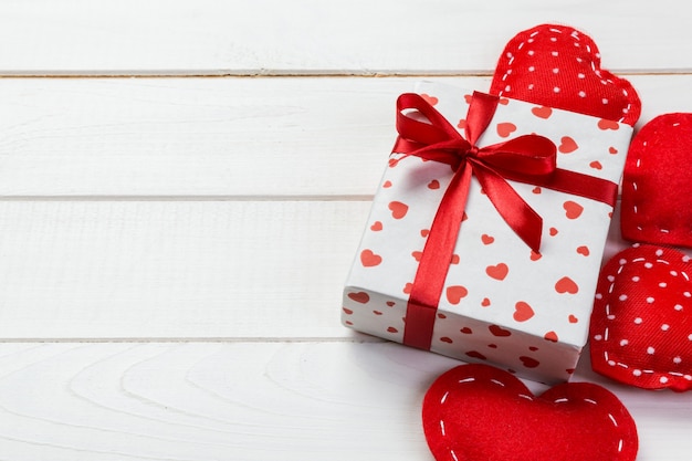 Wrapped present with ribbon and textile hearts