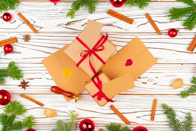 Wrapped present on a wooden  with Christmas holiday decorations top view