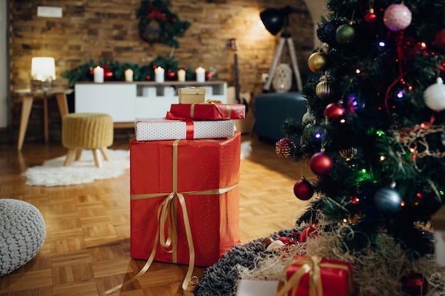 Wrapped presents under the Christmas tree at home