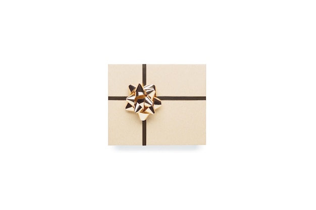 Photo wrapped vintage gift box with golden ribbon bow isolated on white background