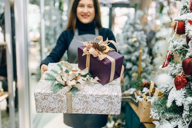 Wrapping service seller with festive gift boxes