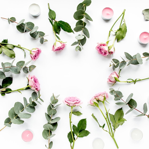 Wreath frame with roses eucalyptus branches leaves isolated on white background flat lay overhead view