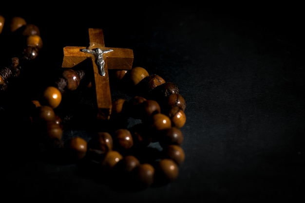 Wreath of the holy wooden rosary on a black background