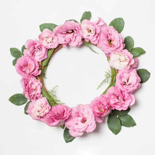 Wreath of rose flowers and green plants