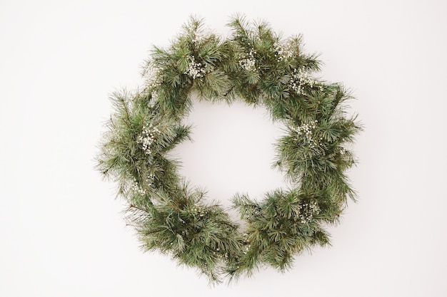 Wreath of spruce for New Year and Christmas decorations Frame wreath with copy space on white