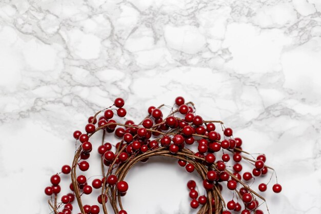 A wreath with red berries on it