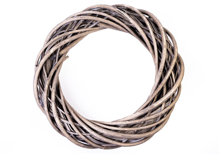 Wreath woven from the branches of the vine isolated Place for text