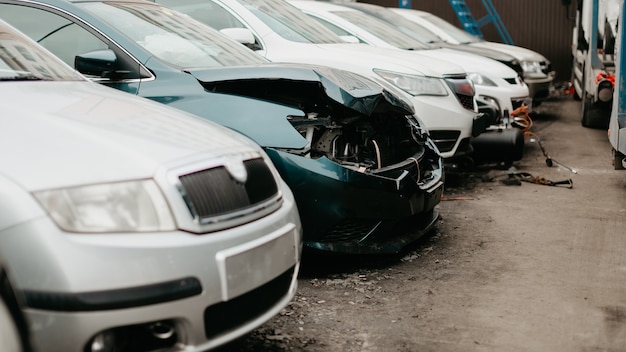 Wrecked cars after traffic accident crash. Insurance salvage vehicle auction wholesale storage. Featuring Used, Wholesale and Salvage Cars.