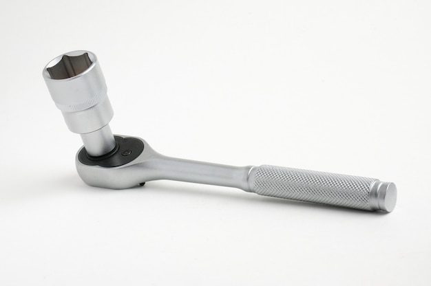 Wrench for nuts and bolts on an isolated white
