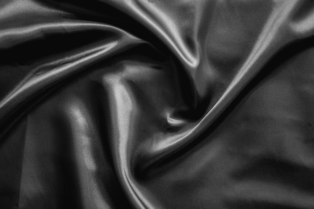 Wrinkle black satin cloth texture background