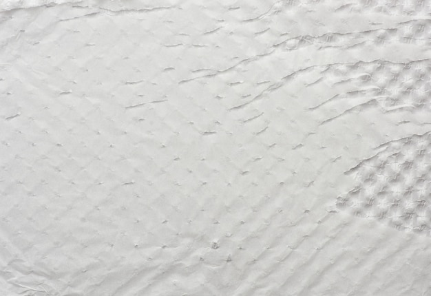 Wrinkled and damaged sheet of white paper