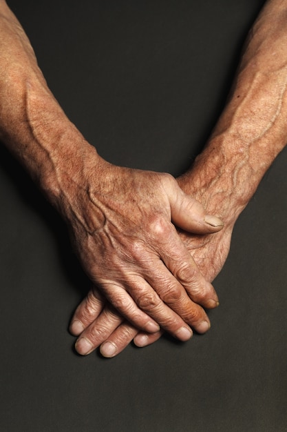 Wrinkled hands of an elderly man