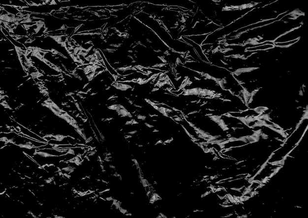 wrinkled plastic wrap texture effect on a black background wallpaper