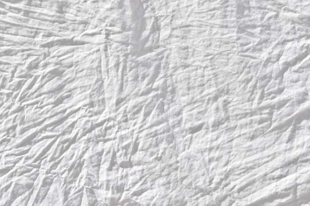 しわの白い布のテクスチャ布テクスチャ背景