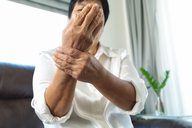 Photo wrist hand pain of old woman, healthcare problem of senior concept