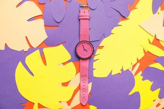 Photo wrist watch with paper tropical leaves