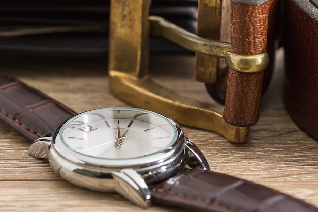 Wristwatch and brown leather belt