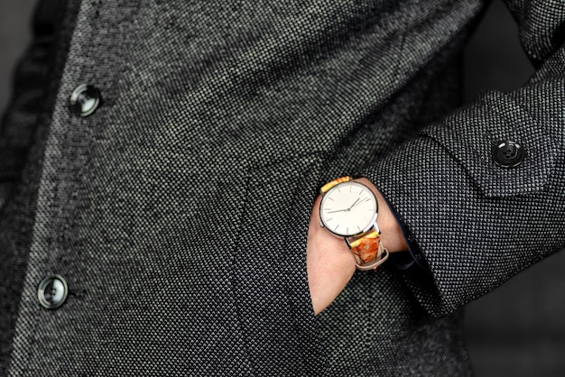 Wristwatch on hand of elegant fashion man