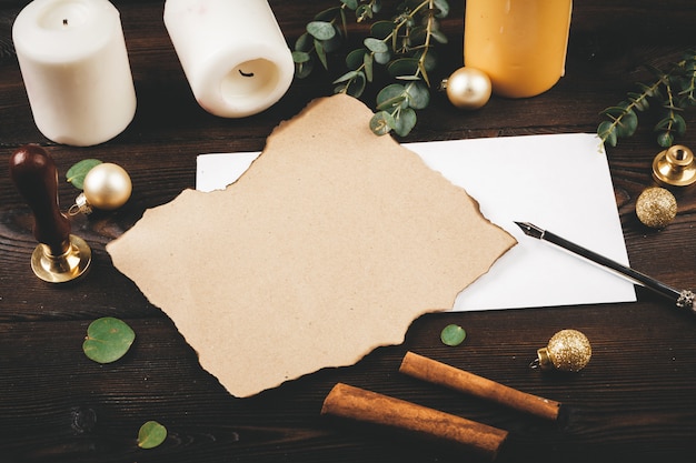 writing christmas post on holiday wooden decorated background 