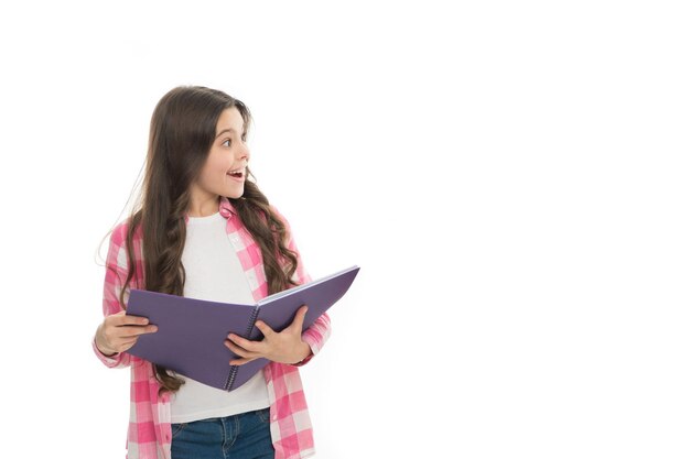 Writing making notes School routine Educational process Little girl with writing pad Cute small school child hold open note pad white background copy space Useful pad School stationery concept