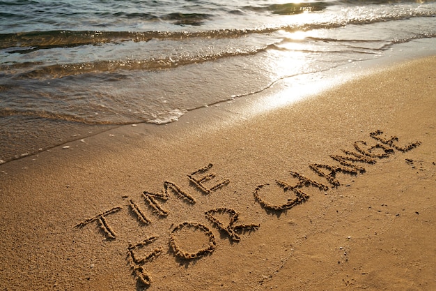 Photo writing words in the sand