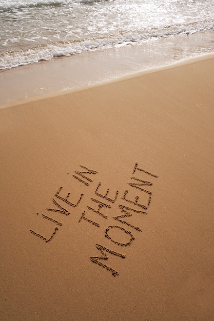 Photo writing words in the sand