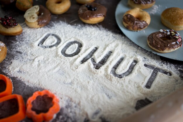 Written letters of dough ready for donut