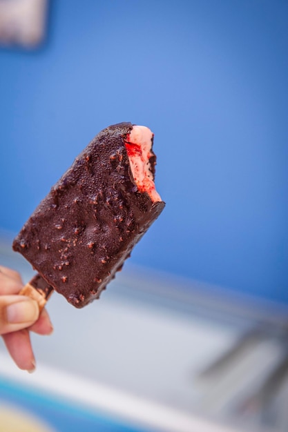 XAEskimo style popsicle strawberry flavor covered with chocolate Copy space