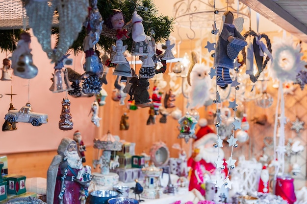 Xmas tree decorations and toys as gift souvenirs at one of the many stalls at the Christmas Fair in Vilnius, Lithuania at Advent