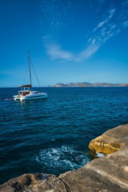 Yacht boat at sarakiniko beach in aegean sea milos island greece