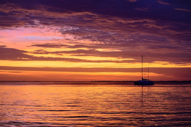 Yacht boat on the sea sailboats at sunset ocean yacht sailing