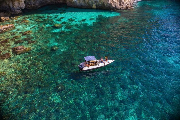 Yacht at comino blue lagoon, bay with turquoise water at comino, malta