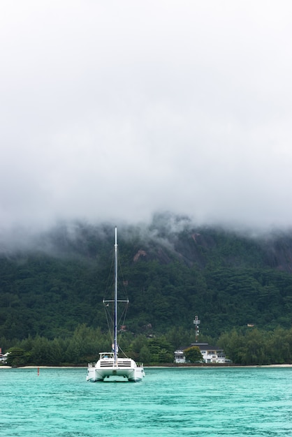 Yacht in fog at the coast