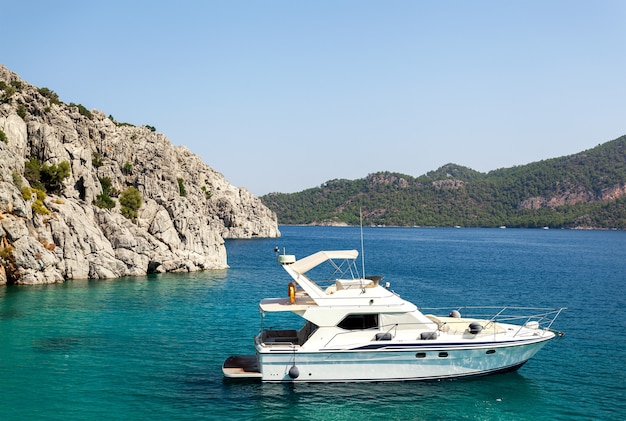 Yacht moored off the coast. background sea