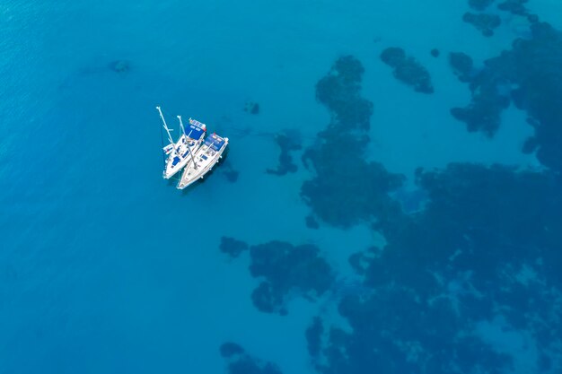 Yacht near the rocky coast in Turkey Luxury vacation at sea