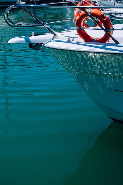 Yacht nose with two lifebuoys